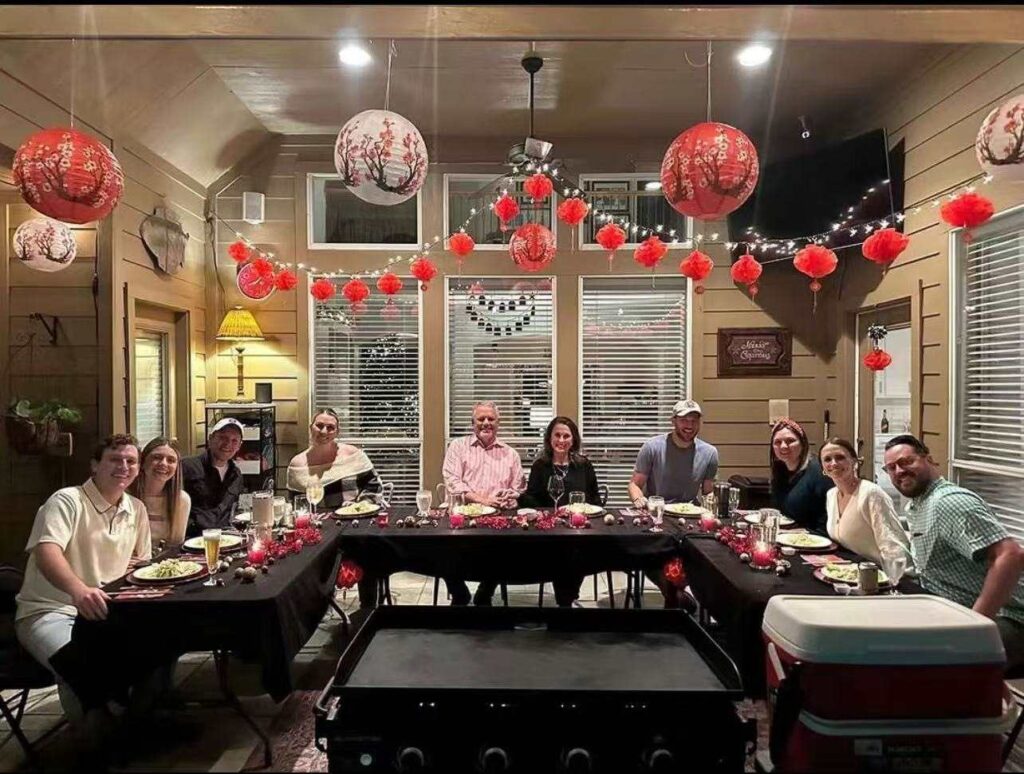 live hibachi cooking show at home Atlanta guests enjoying dinner
