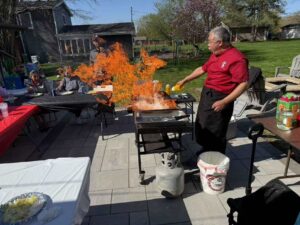 Hibachi at home Chicago with private hibachi chef cooking for backyard party